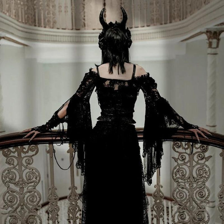 a woman wear a black flared sleeve gothic lace shawl