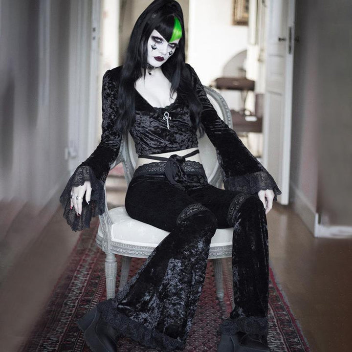 a woman wear a black gothic punk lace panel flare pant