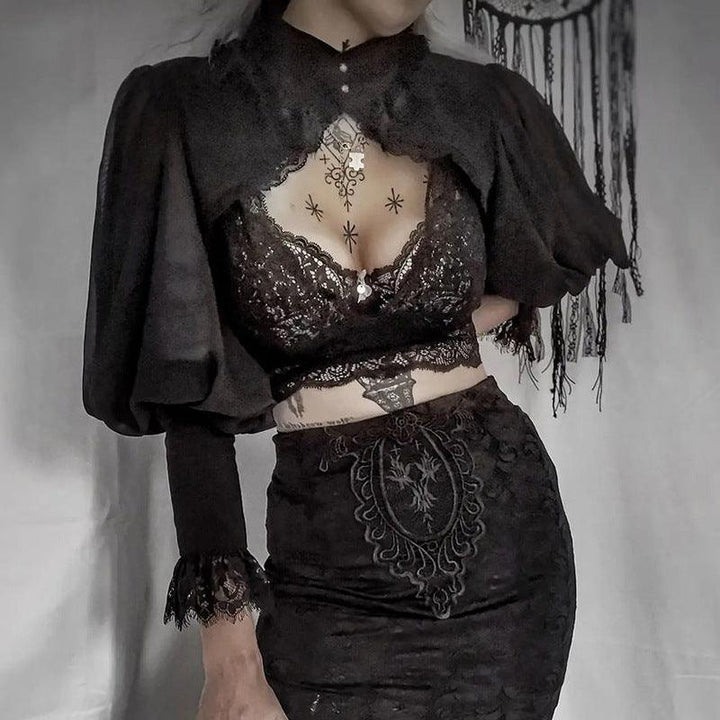 a woman wear a black gothic victorian lace high neck blouse