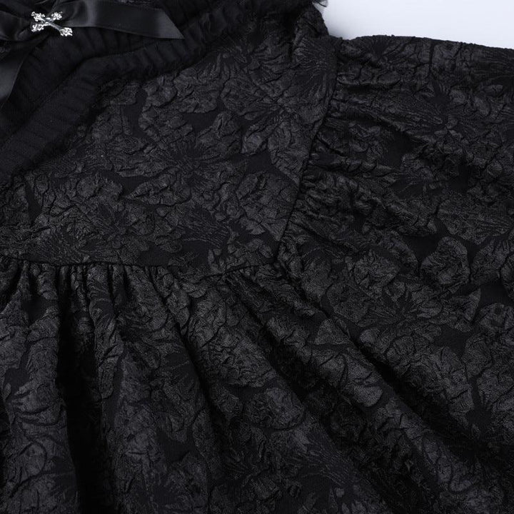 details of a black sleeveless gothic lace short dress