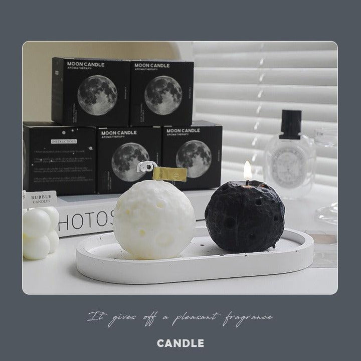 black and white moon shape aromatherapy scented candle on the table