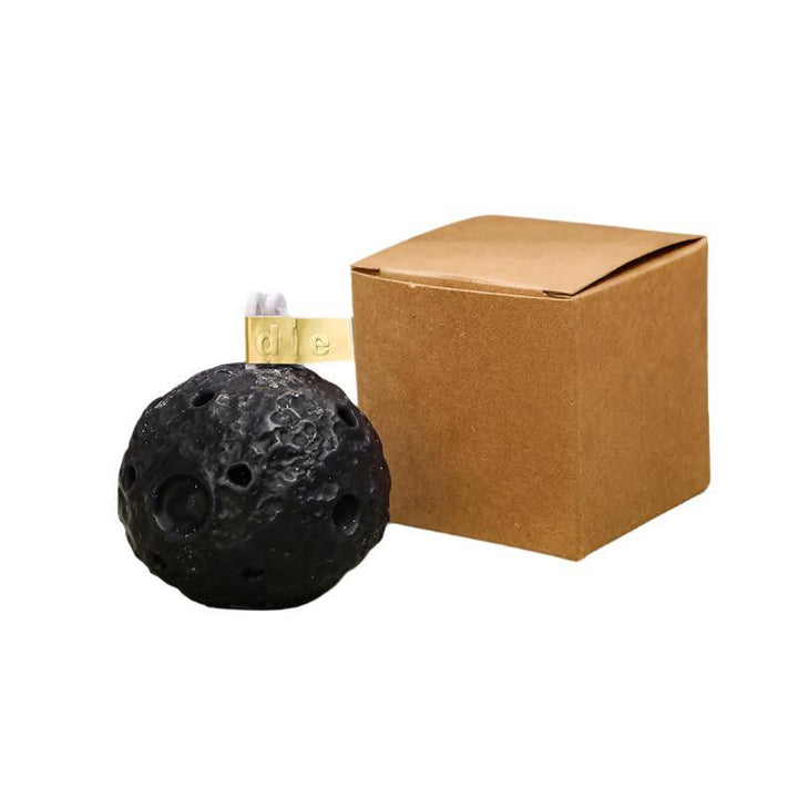 black moon shape aromatherapy scented candle on the table