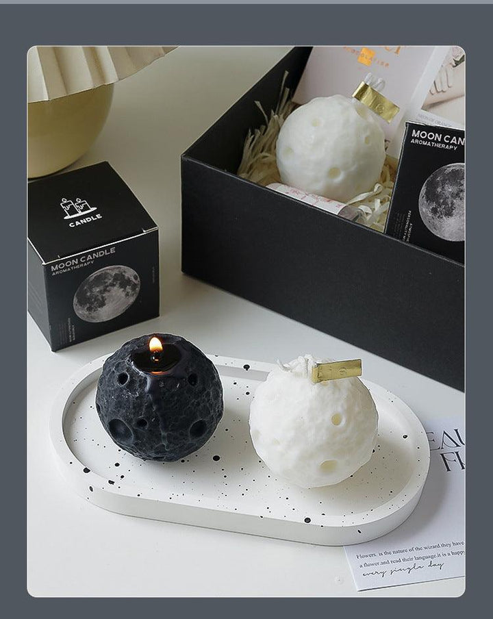 black and white moon shape aromatherapy scented candle on the table