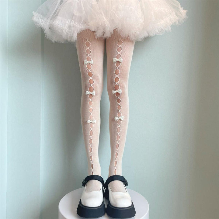 a woman wear bowknot pantyhose hollow lolita sexy white silk bottoms