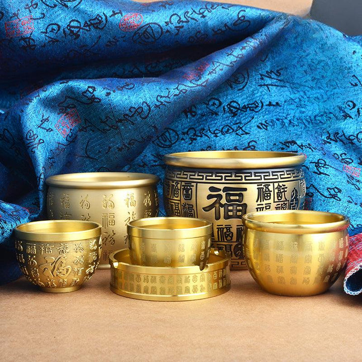 brass wealth treasure bowl ornament with five elements crystal stones on the table