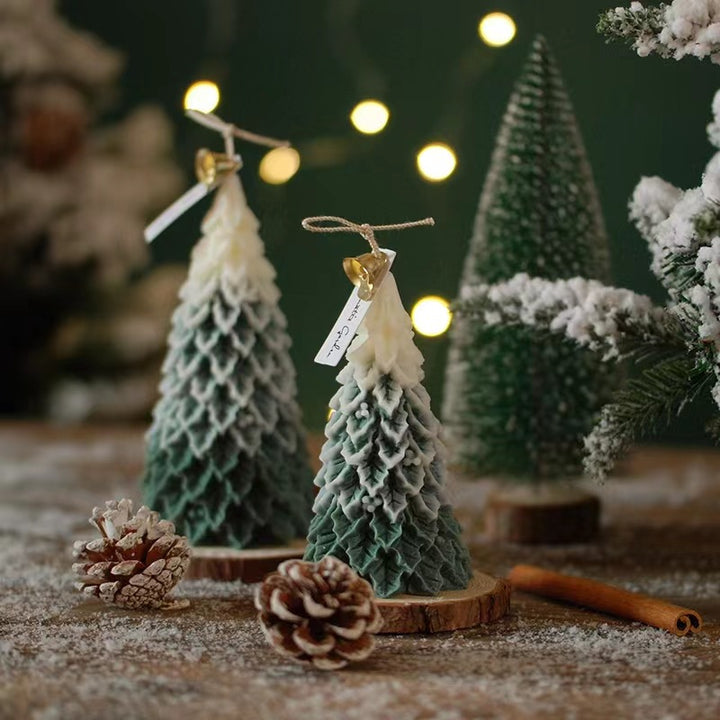 two christmas tree soy wax scented candles on the table