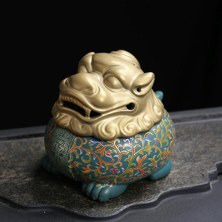 details of colorful mythical animal in enamel incense burner holder