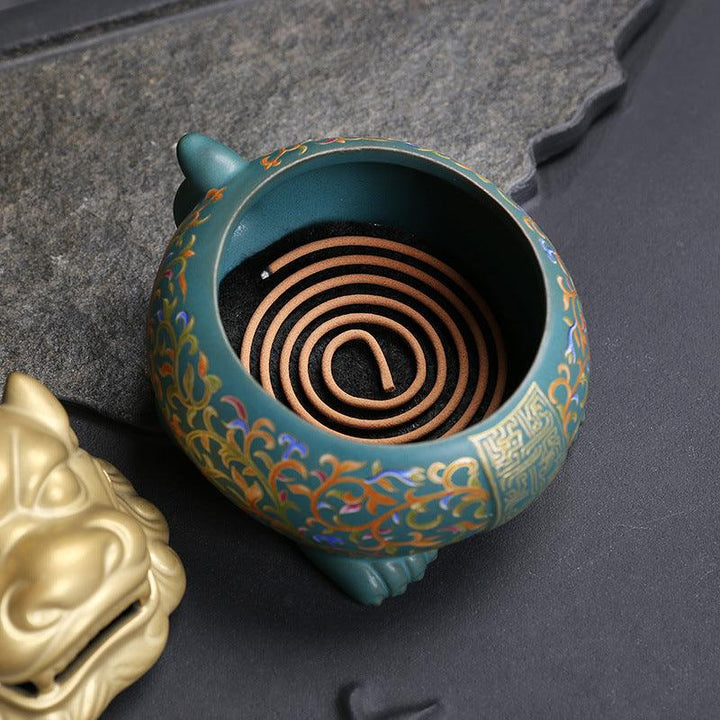 details of colorful mythical animal in enamel incense burner holder