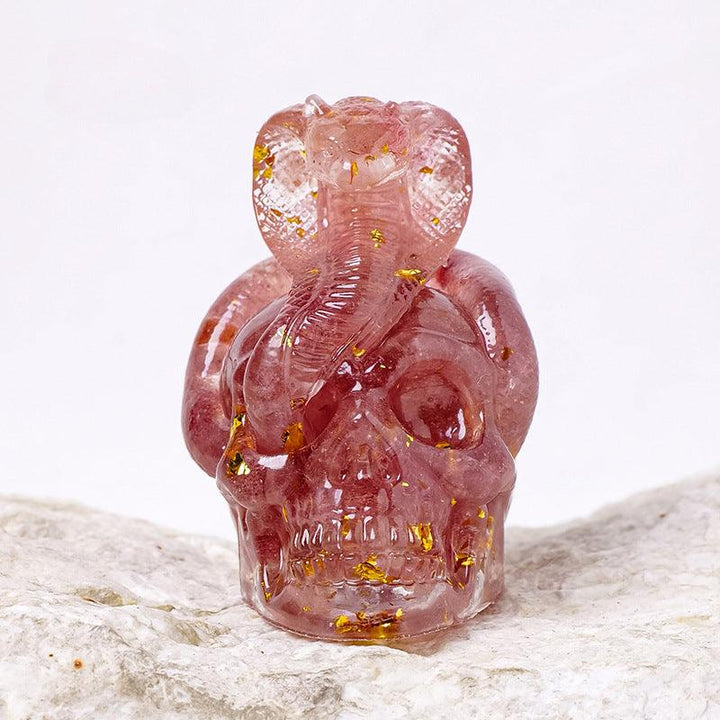 Strawberry Quartz crystal snake wrapped skull resin ornament