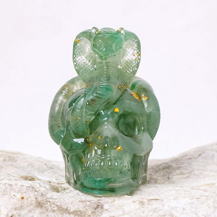 aventurine crystal snake wrapped skull resin ornament