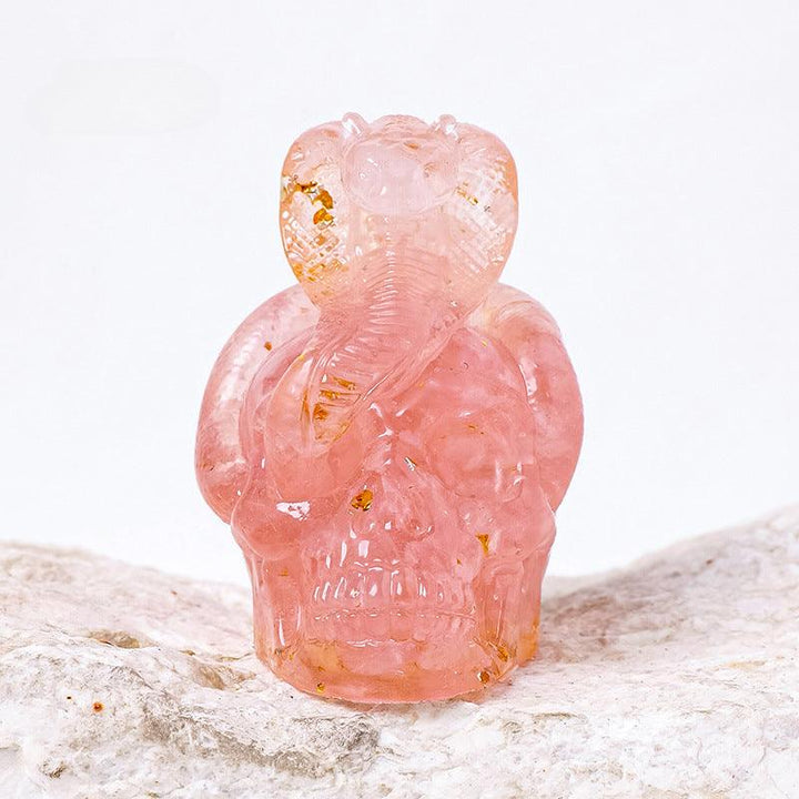 rose quartz crystal snake wrapped skull resin ornament