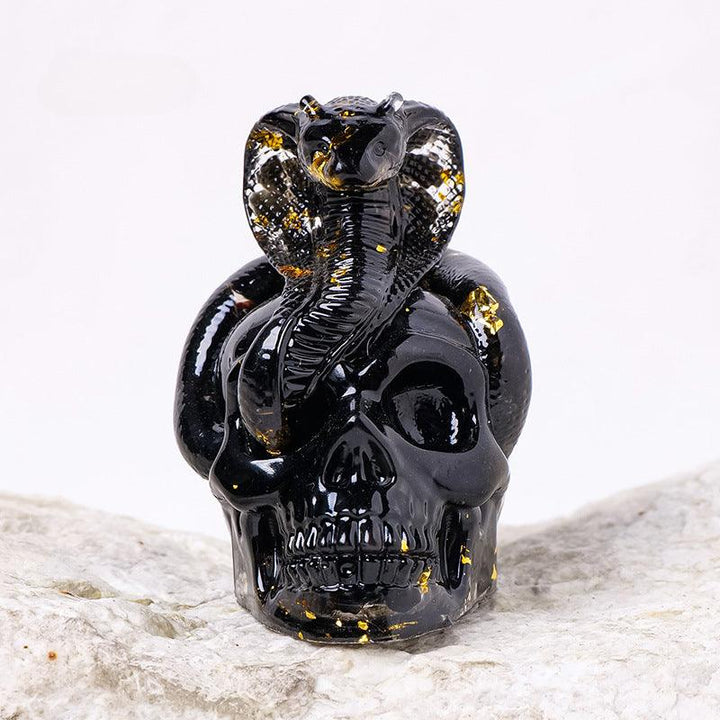 obsidian crystal snake wrapped skull resin ornament