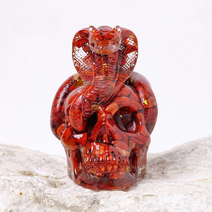 Red Jade crystal snake wrapped skull resin ornament