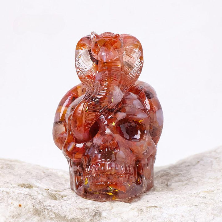 Red Agate crystal snake wrapped skull resin ornament