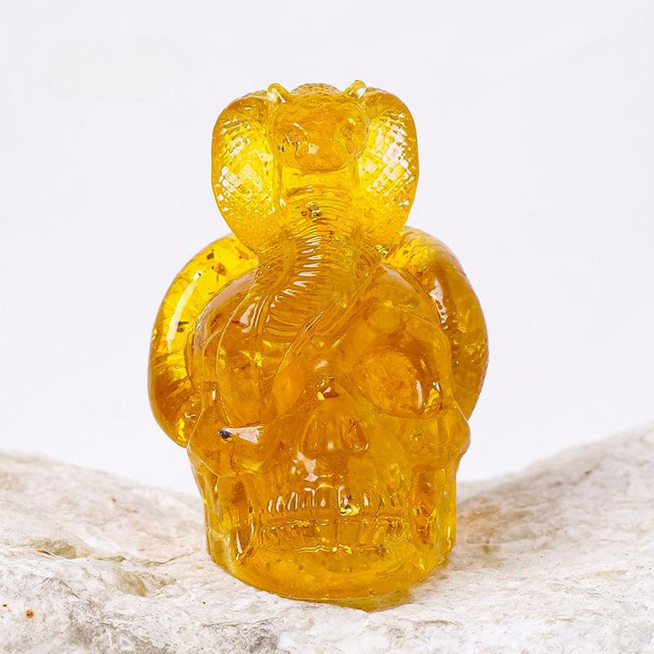 citrine crystal snake wrapped skull resin ornament