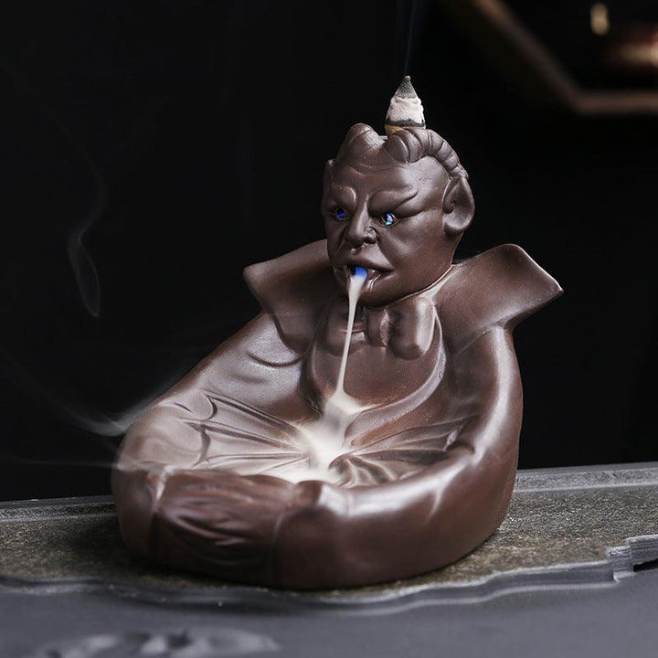 a dark gothic wizard backflow incense burner holder on the table