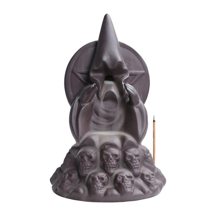 a dark gothic wizard backflow incense burner holder 