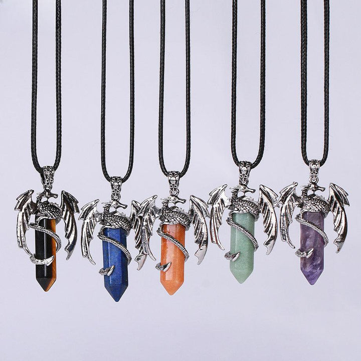 dragon shaped crystal stone pendant spirit pendulum pendant on the table