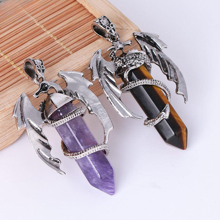 dragon shaped crystal stone pendant spirit pendulum pendant on the table