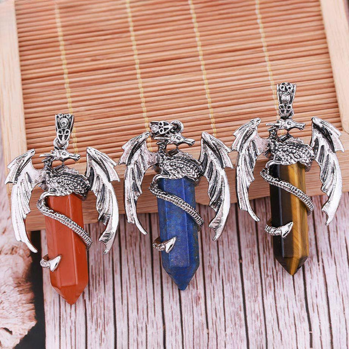 dragon shaped crystal stone pendant spirit pendulum pendant on the table