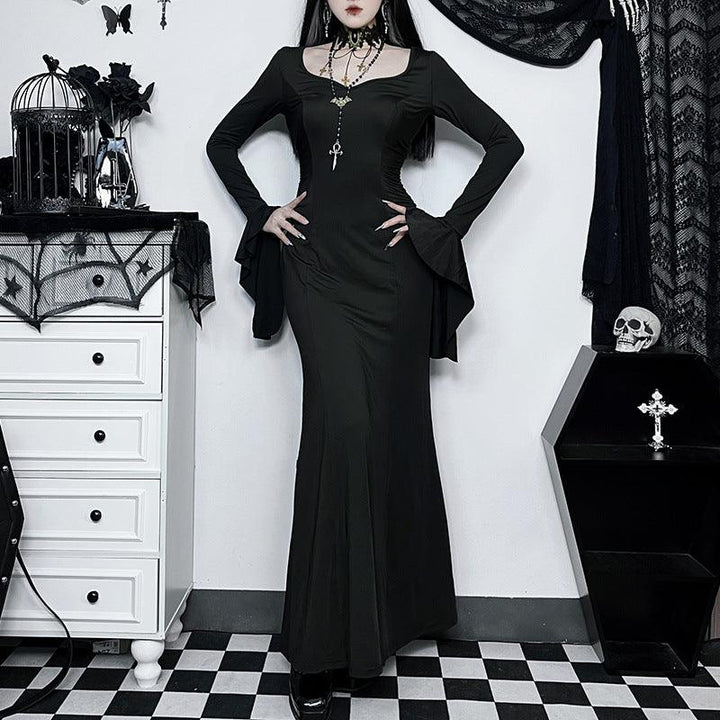 a woman wear the adams family fishtail goth long dress