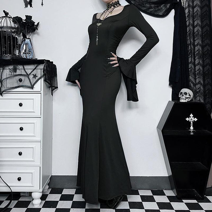 a woman wear the adams family fishtail goth long dress