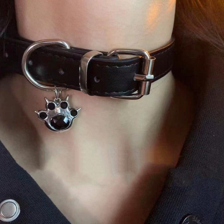 a gothic black leather buckle dog paw choker