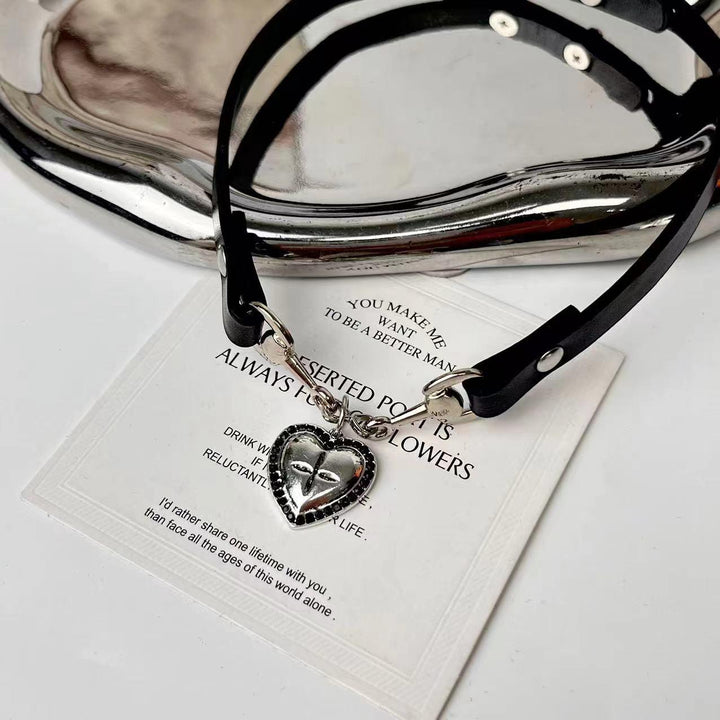 a gothic black leather buckle heart choker