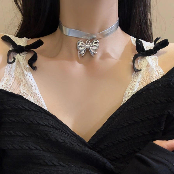 a gothic black leather buckle silver bow tie choker