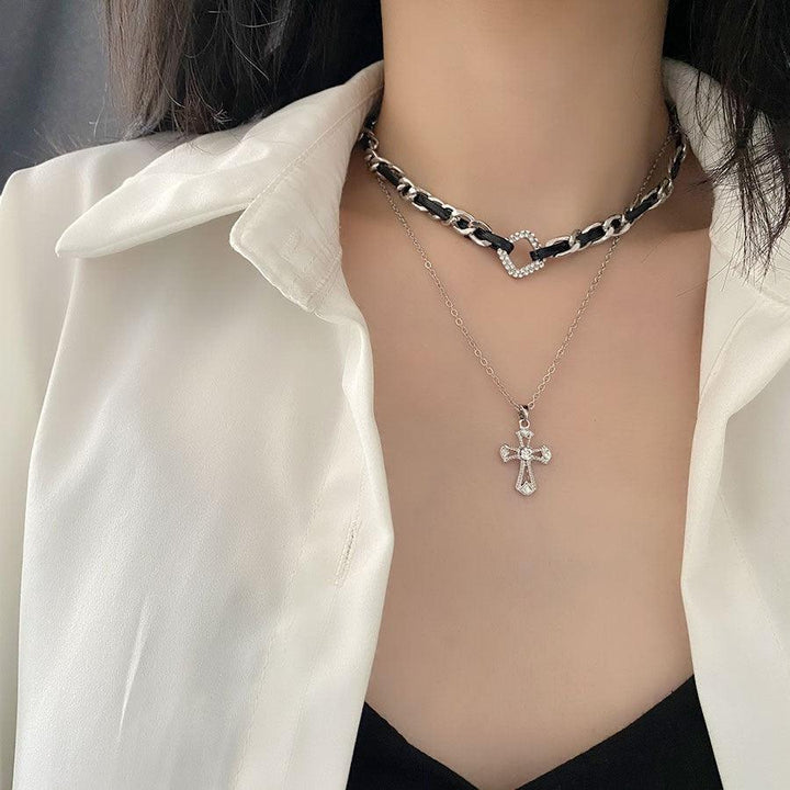 a gothic black leather buckle balck and white cross chain choker