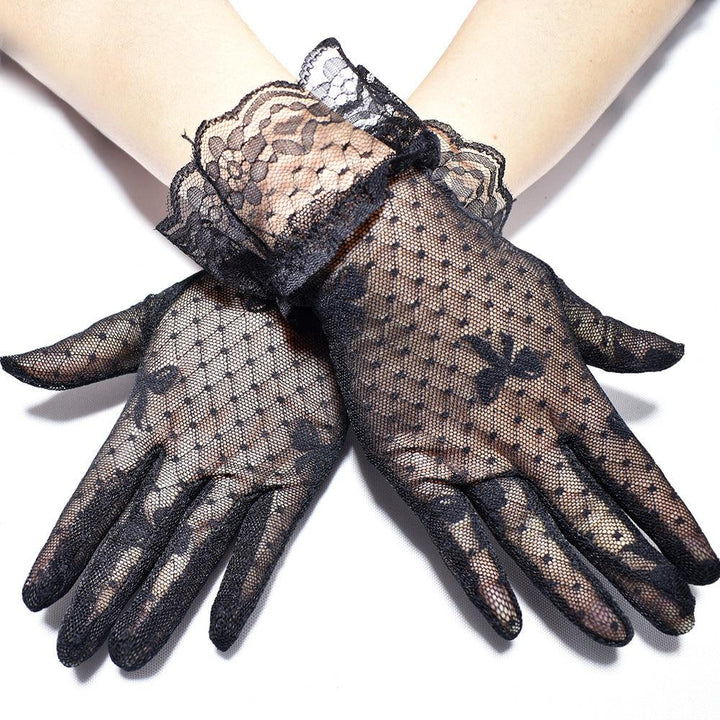 a woman wear gothic black mesh bow lace short gloves