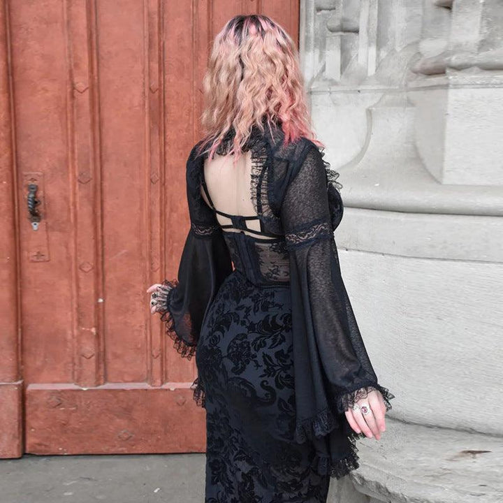 a woman wear a gothic lace flared long sleeve casual black shawl