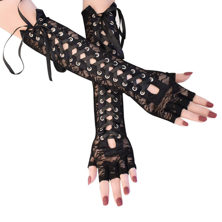 a woman wear gothic lolita lace black strap half finger gloves