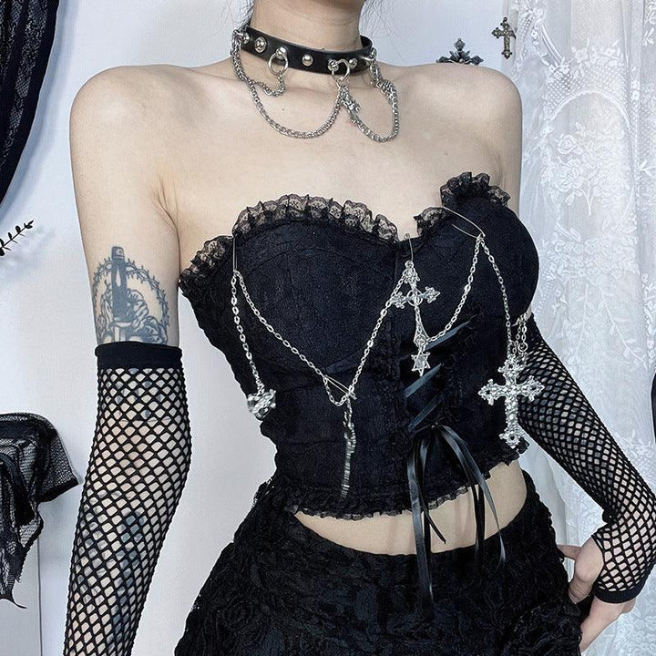 a woman wear a gothic sleeveless black cross chain strap top