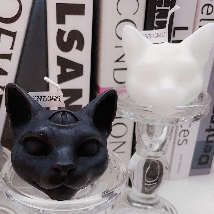 gothic three eyed cat shape aromatherapy scented candles on the table