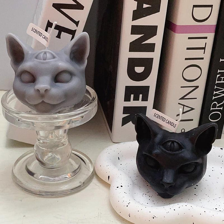 gothic three eyed cat shape aromatherapy scented candles on the table