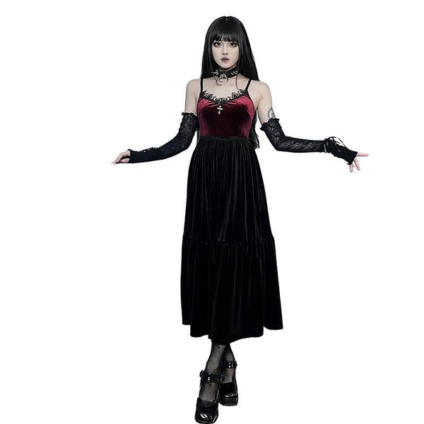 a woman wear a gothic witchy black red suede sleeveless dress