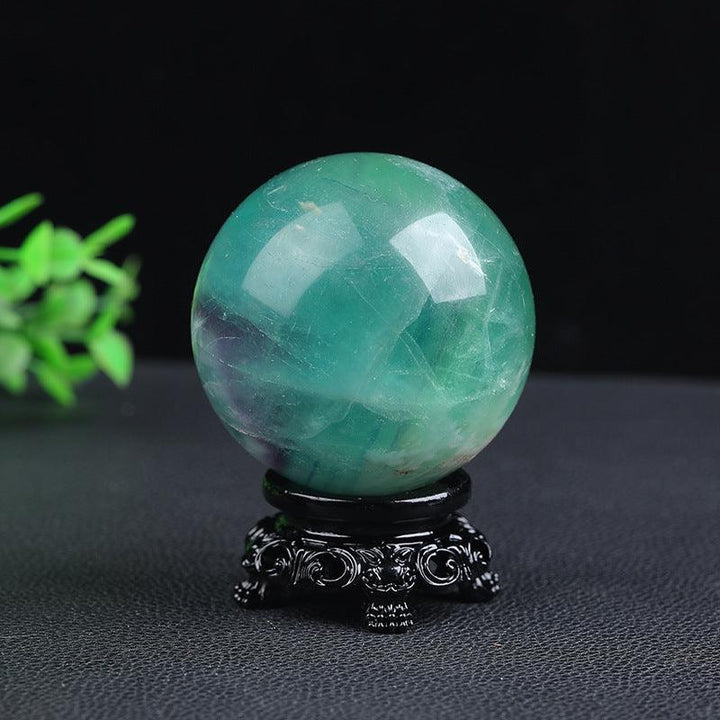 green phantom crystal ball energy gemstone statues on the table