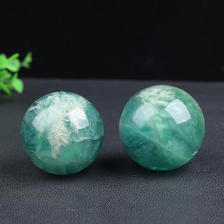 details of green phantom crystal ball energy gemstone statues