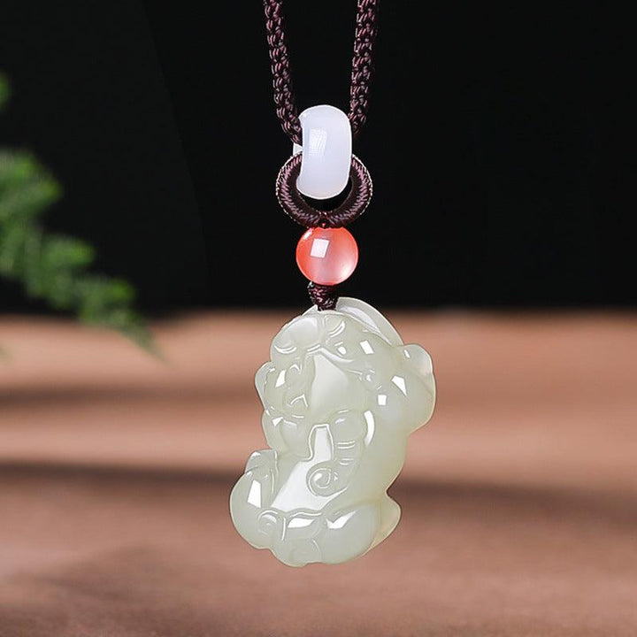 hetian jade money pixiu pendant natural jade couple necklace on the table