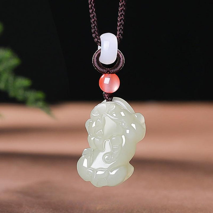 hetian jade money pixiu pendant natural jade couple necklace on the table