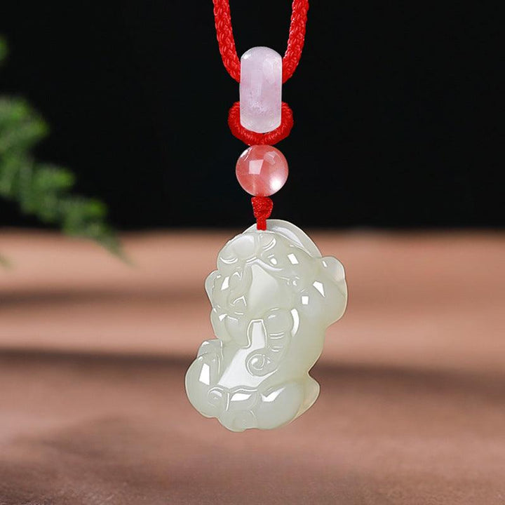 hetian jade money pixiu pendant natural jade couple necklace on the table