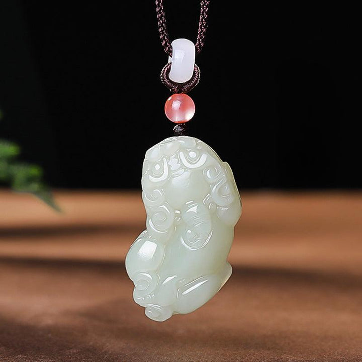 hetian jade money pixiu pendant natural jade couple necklace on the table