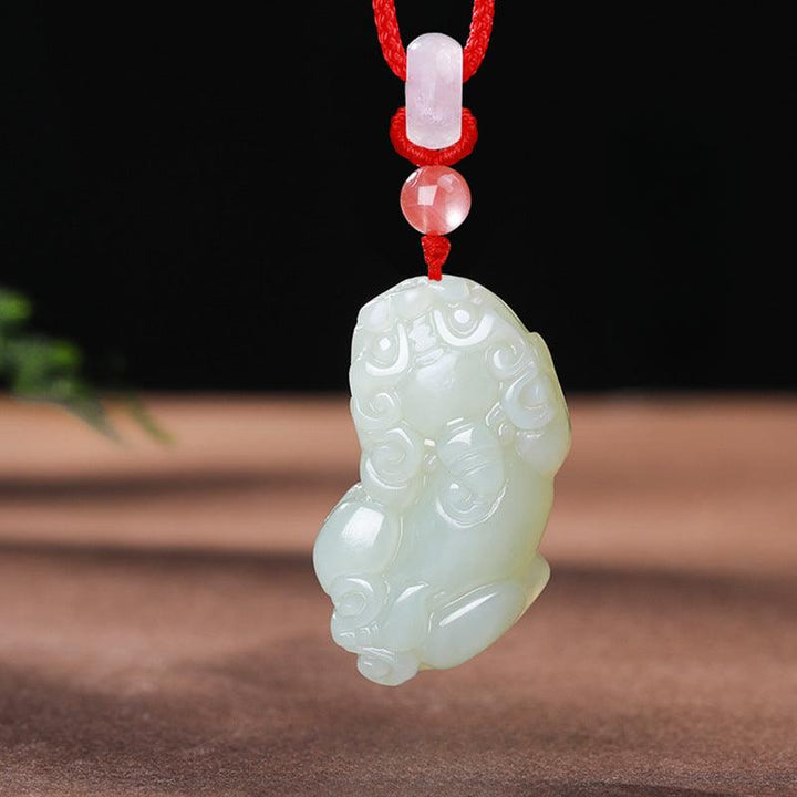 hetian jade money pixiu pendant natural jade couple necklace on the table