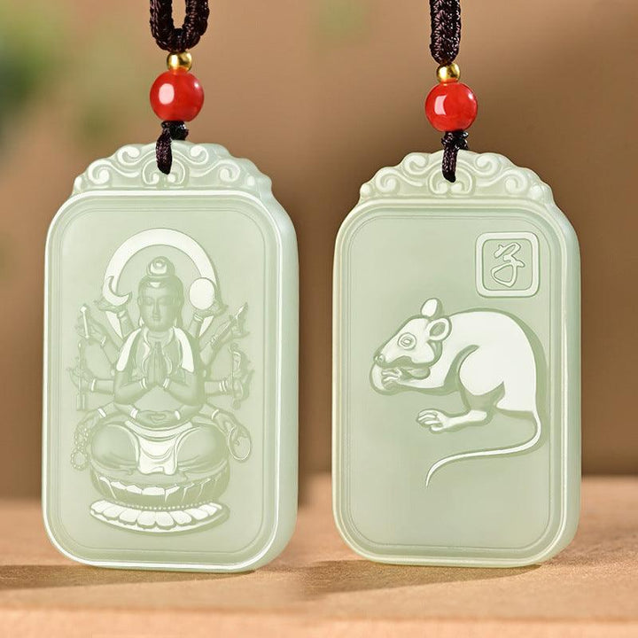 hetian jade pendant buddha of the chinese zodiac necklace on the table