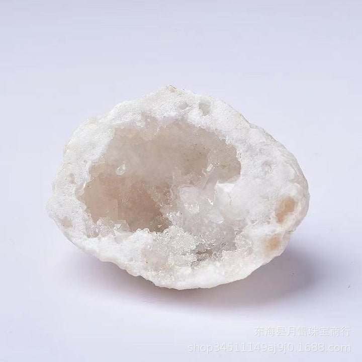 a morocco agate cave white crystal cave ornament on the table