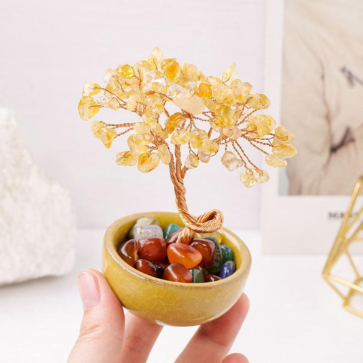 citrine crystal bonsai tree with agate treasure bowl on the hand