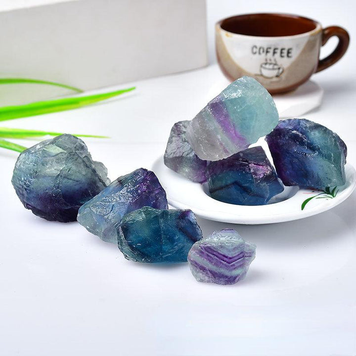 natural rainbow fluorite crystal raw stone fluorite on the table