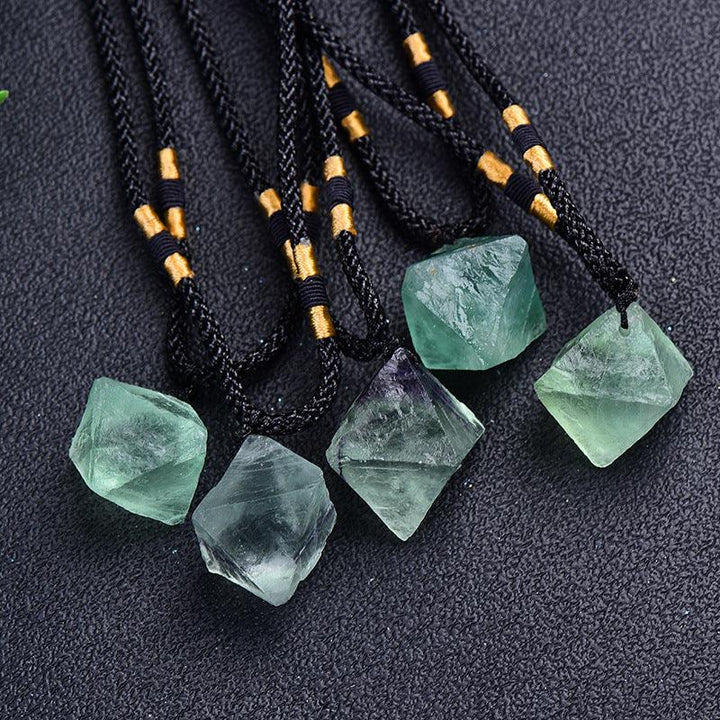 natural spirit pendulum green fluorite octahedron necklace on the table