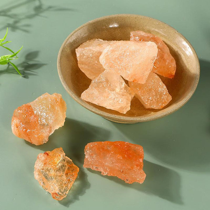 orange salt stone crystal raw aromatherapy incense stone on the table